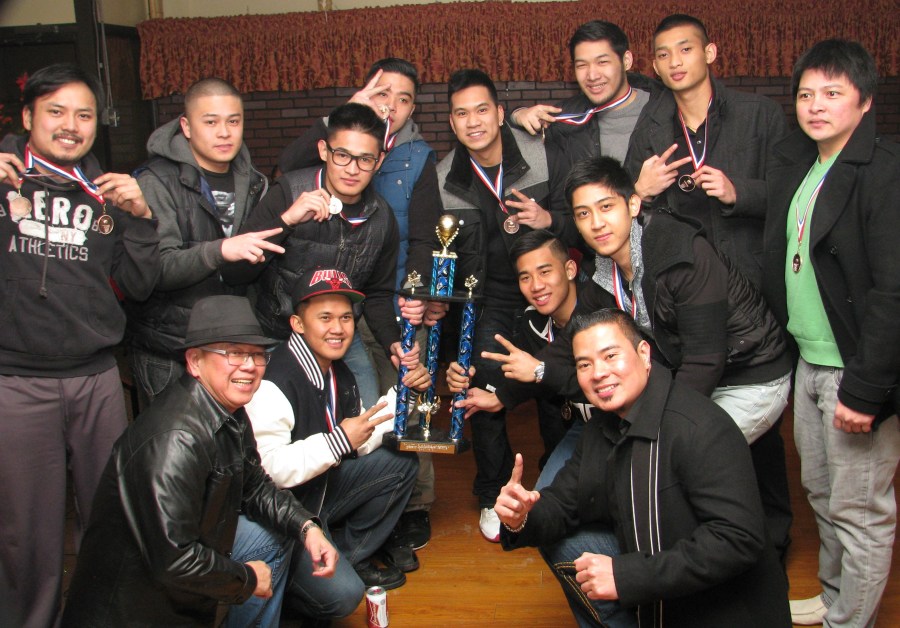 Crosstown Auto Centre's Tony Surtida (left with hat) and PSA second VP Allan Angeles join Team Crooks' celebration.(pinoy edmonton news)
