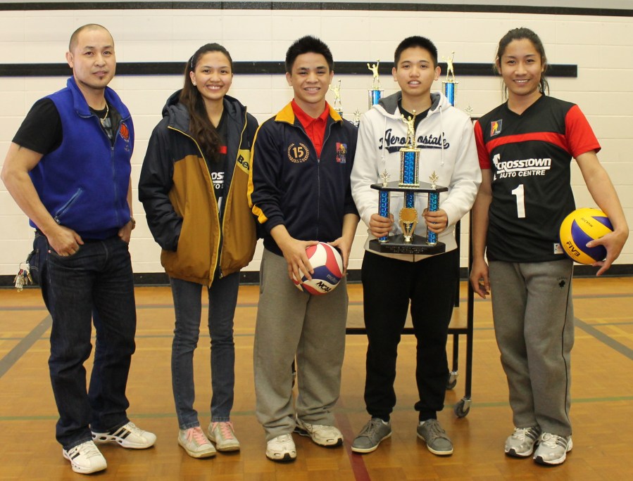 Four members of the Black Team led by Mark Perpetua (extreme right) receive their third place trophy at the close of the 2014 PSA-Crosstown Auto Coed volleyball league, March 30, at the St.Clement Catholic School.(Photo by Moses Billacura/pinoy edmonton news)