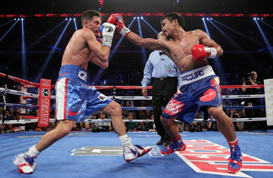 PACQUIAO BLOWS OUT ALGIERI Welterweight champ Manny Pacquiao knocked Chris Algieri down six times to claim a unanimous decision win Saturday at the Venetian Macao. Scores: 119-103 (2x), 120-102.(Photo Credit: Chris Farina / Top Rank)